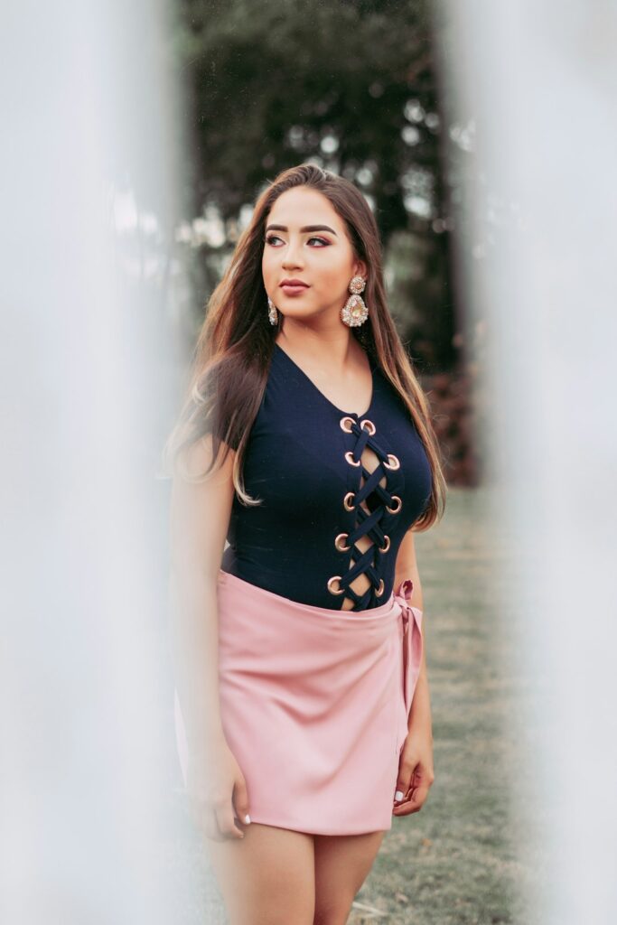 woman-in-black-tank-top-and-pink-skirt-nf3cz1elila